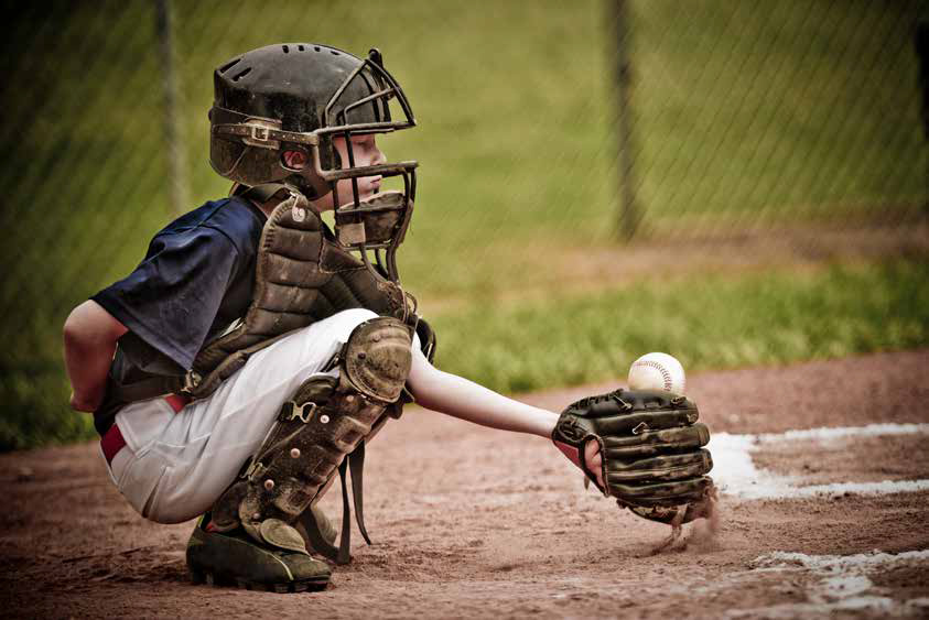 Child catching a baseball