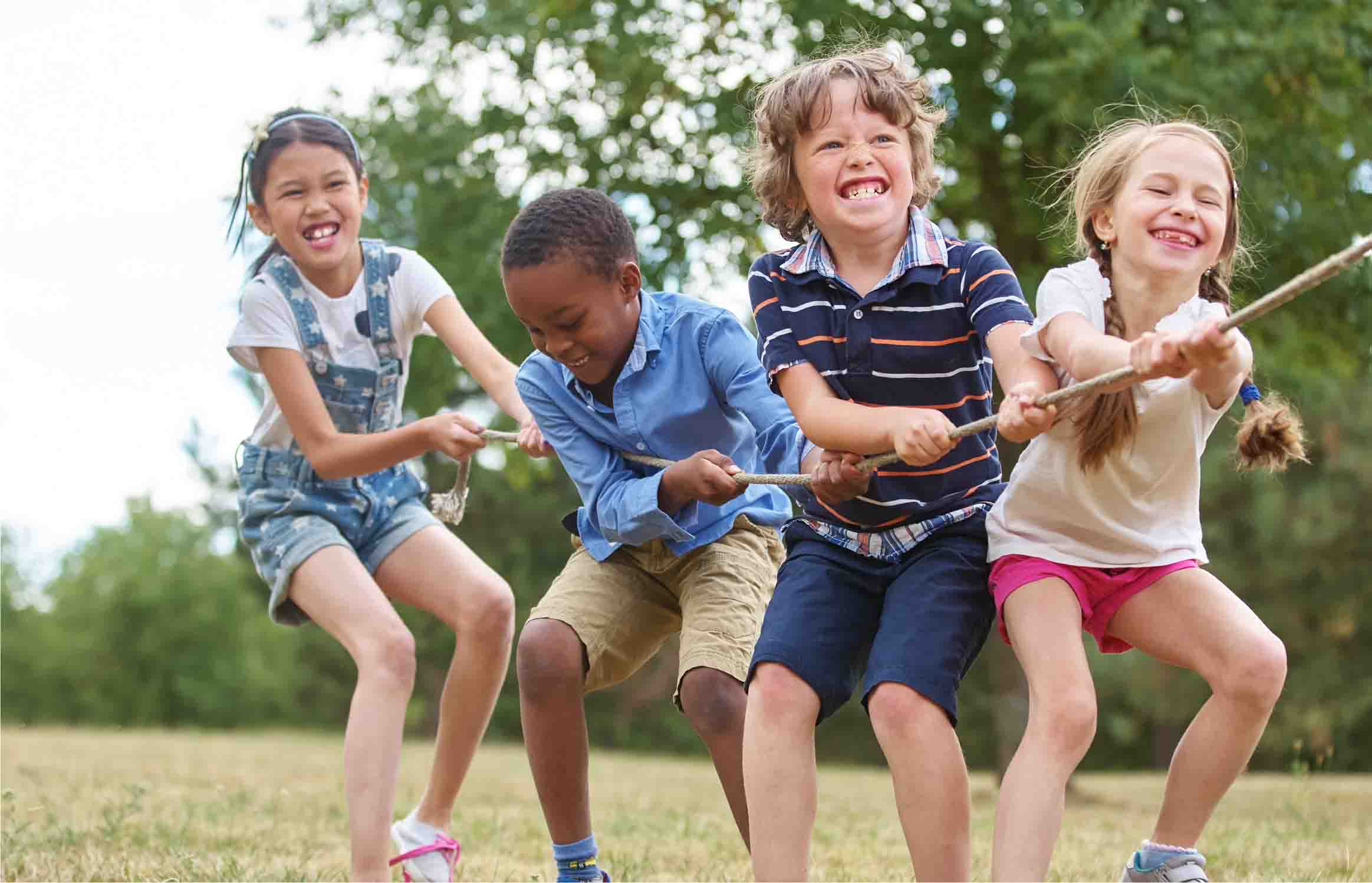 Four kids playing tug-o-war